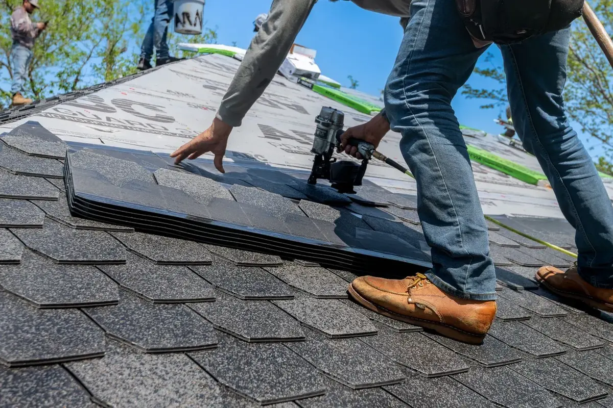 Local roofing contractor inspecting an asphalt shingle roof in Spring Texas